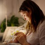 new mom holding her child